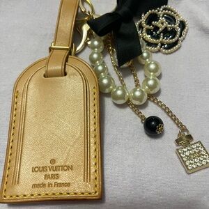 4. Louis Vuitton Luggage Tag with Unbranded Pearl and Black Accents